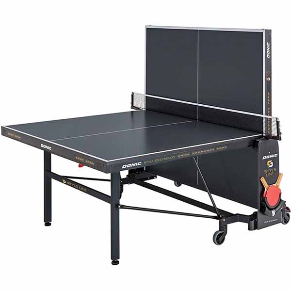 Стіл тенісний DONIC Indoor Style 1000 Anthracite (230241) Додатково стільниця 22 мм із спецпокриттям (Trajectory Rebound System); порошкове покриття каркасу; профіль рами 50 мм; профіль ніжок 50x30 мм; регульовані по висоті ніжки; регульована по висоті сітка; 4 гумові подвійні ролики Ø128 мм