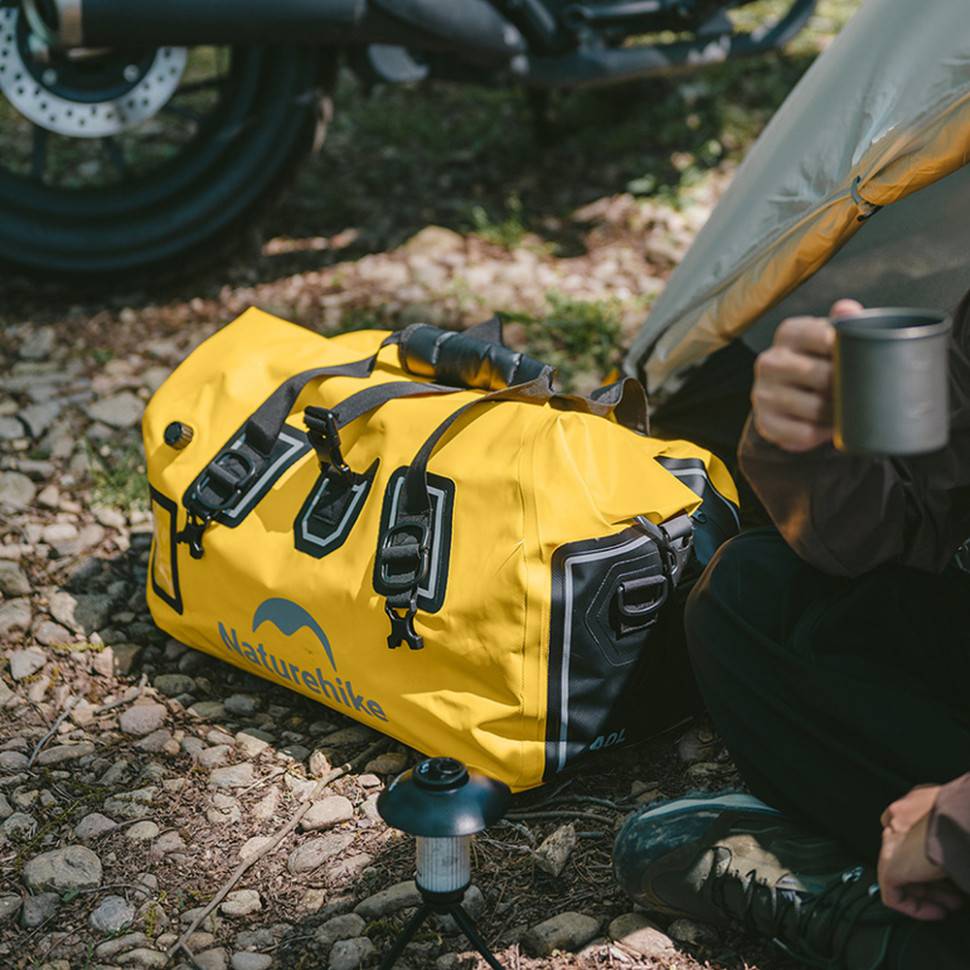 Дорожная сумка NATUREHIKE 90 л Yellow (CNK2450XB015) Дополнительно Клапан для спуска воздуха, светоотражающие элементы